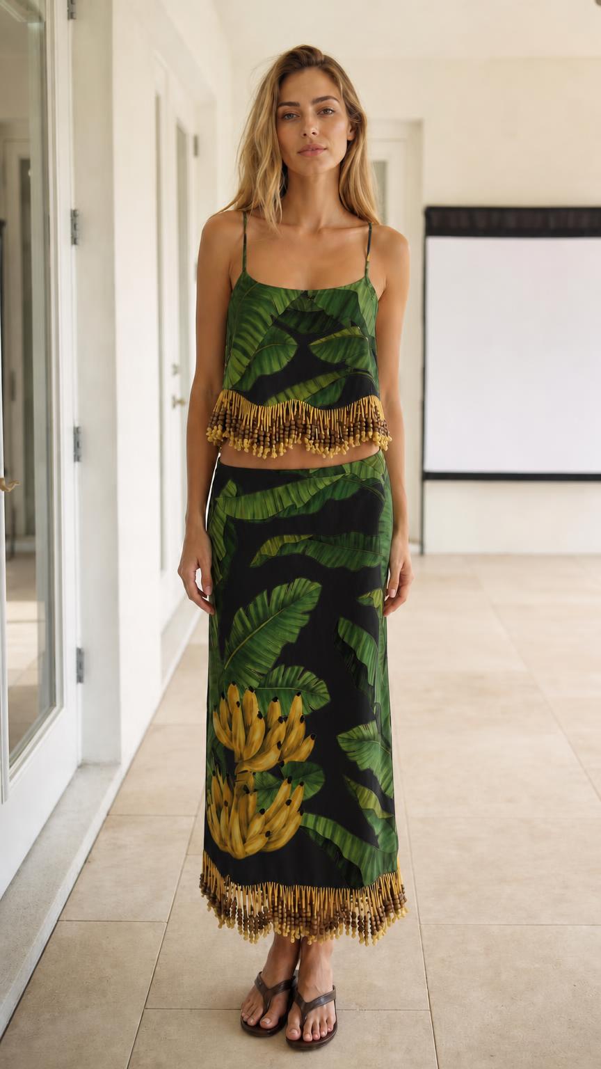 Model wearing black color variant of the tropical leaf print two-piece set